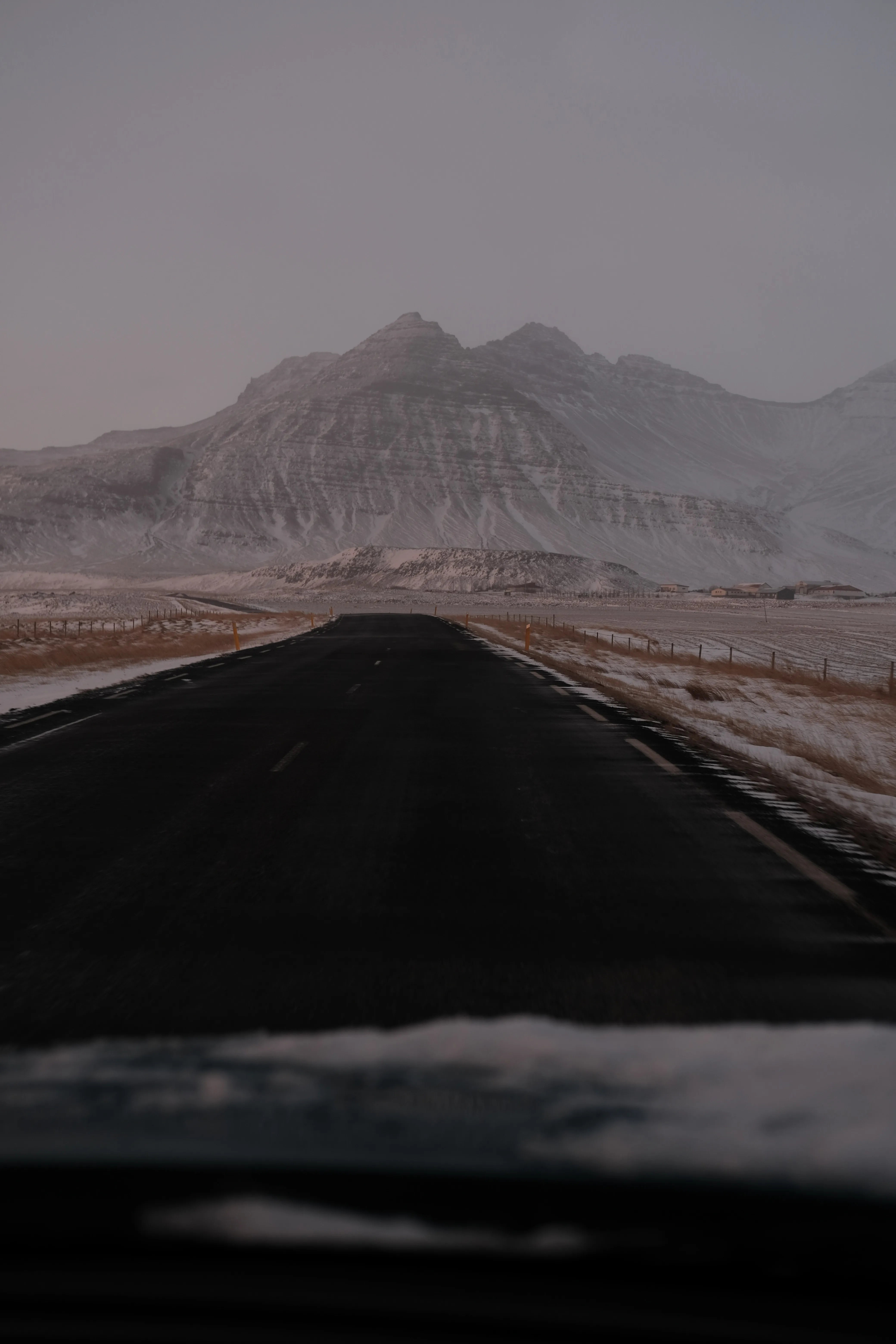 19_twilight road leading to snow covered mountain.2bd41593