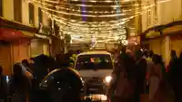 crowded street decorated with lights.2b203e6a